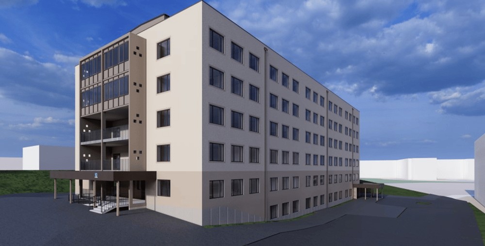 En arkitektrendering av hus 10 på Hudiksvalls sjukhus som det kommer att se ut efter ombyggnation. Byggnaden har fem våningar över mark. Fasaden är ljus och över entrén på kortsidan finns balkonger. 